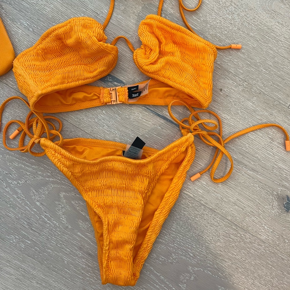 Orange textured bikini by TRIANGL with matching bikini bag.